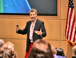 Speaker in red pants